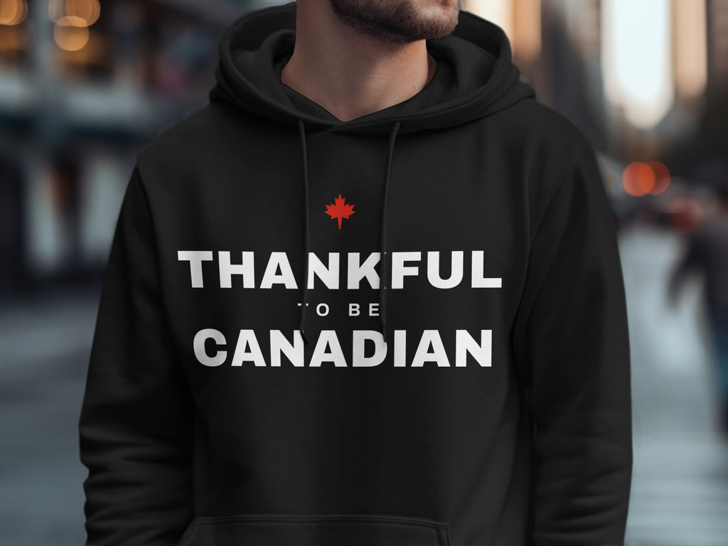 Black hoodie with "THANKFUL TO BE CANADIAN" text and a red maple leaf.