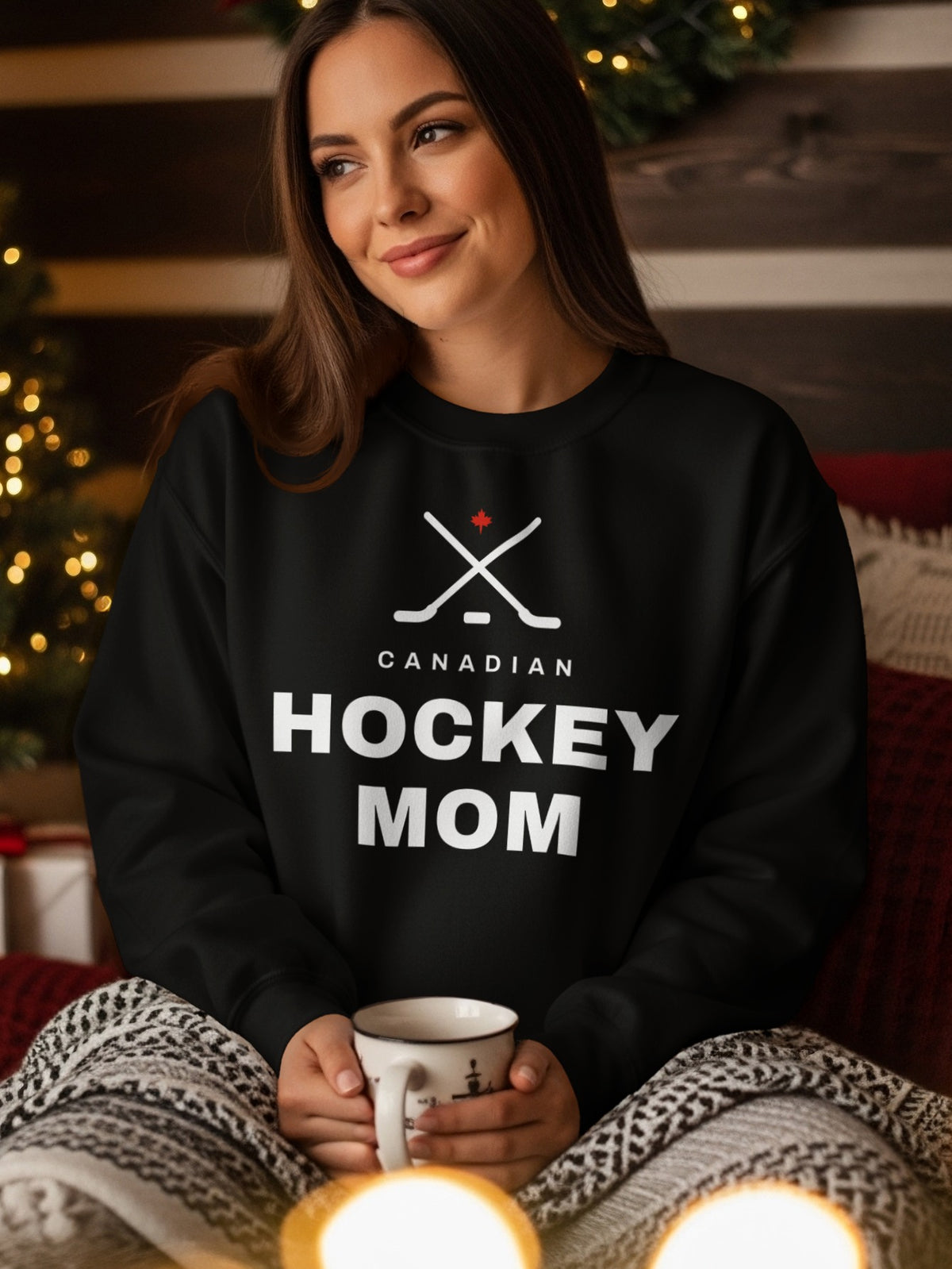 Black sweatshirt with "Canadian Hockey Mom" text and crossed hockey sticks graphic.