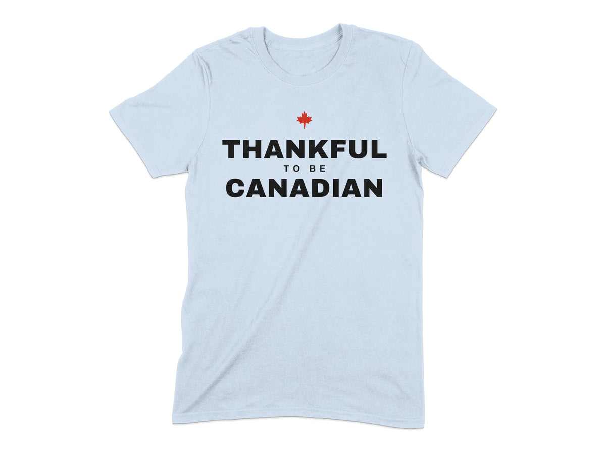 Light blue t-shirt with black text "THANKFUL TO BE CANADIAN" and a red maple leaf.