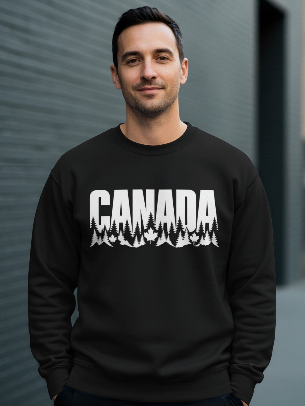 Black crewneck sweatshirt with white "CANADA" text and forest landscape graphic.