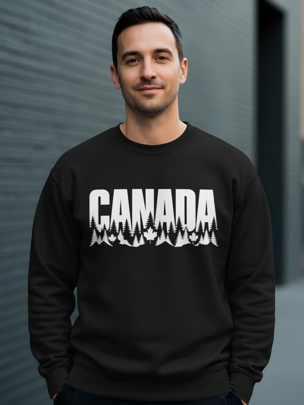 Black crewneck sweatshirt with white "CANADA" text and forest landscape graphic.
