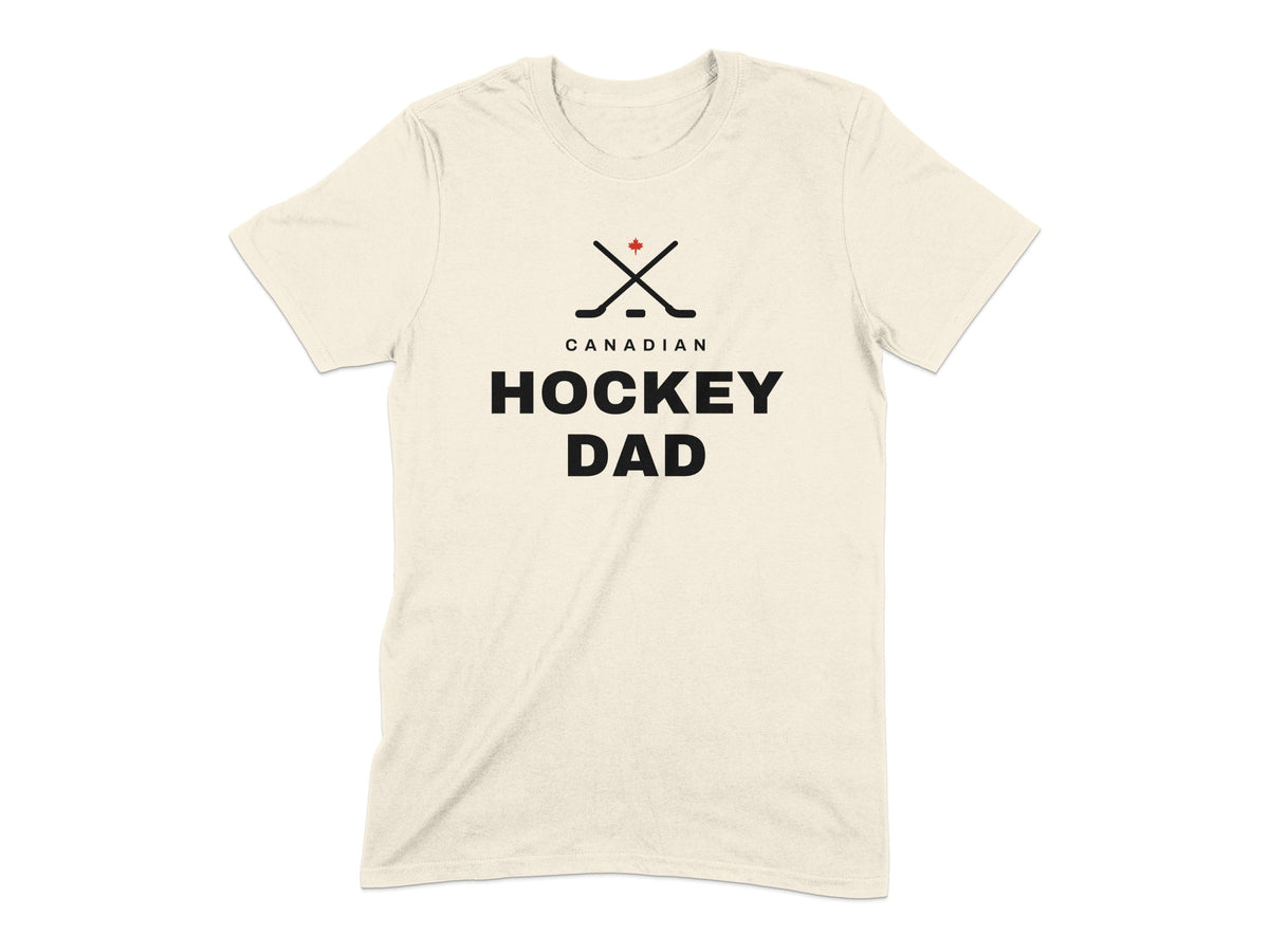 Cream t-shirt with black text "CANADIAN HOCKEY DAD" and crossed hockey sticks with maple leaf.