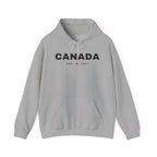 Grey hooded sweatshirt with "CANADA EST. 1867" printed on the chest.