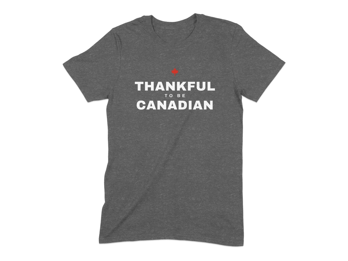 Dark grey t-shirt with white text reading "THANKFUL TO BE CANADIAN" and a red maple leaf.