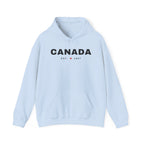 Light blue hoodie with "CANADA EST. 1867" and a maple leaf graphic.