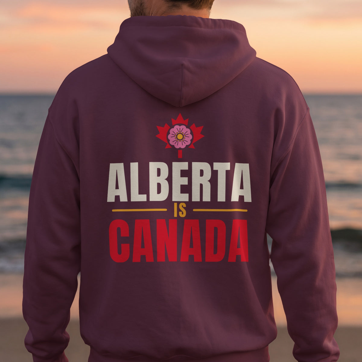 Maroon hoodie with "Alberta is Canada" text and floral maple leaf graphic.