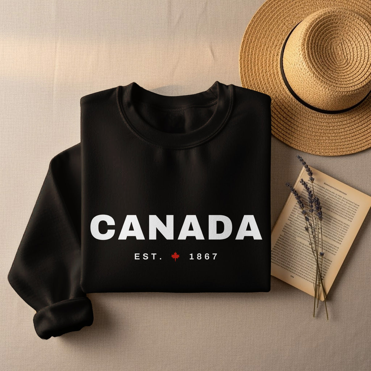Black sweatshirt with "CANADA EST. 1867" and maple leaf graphic.