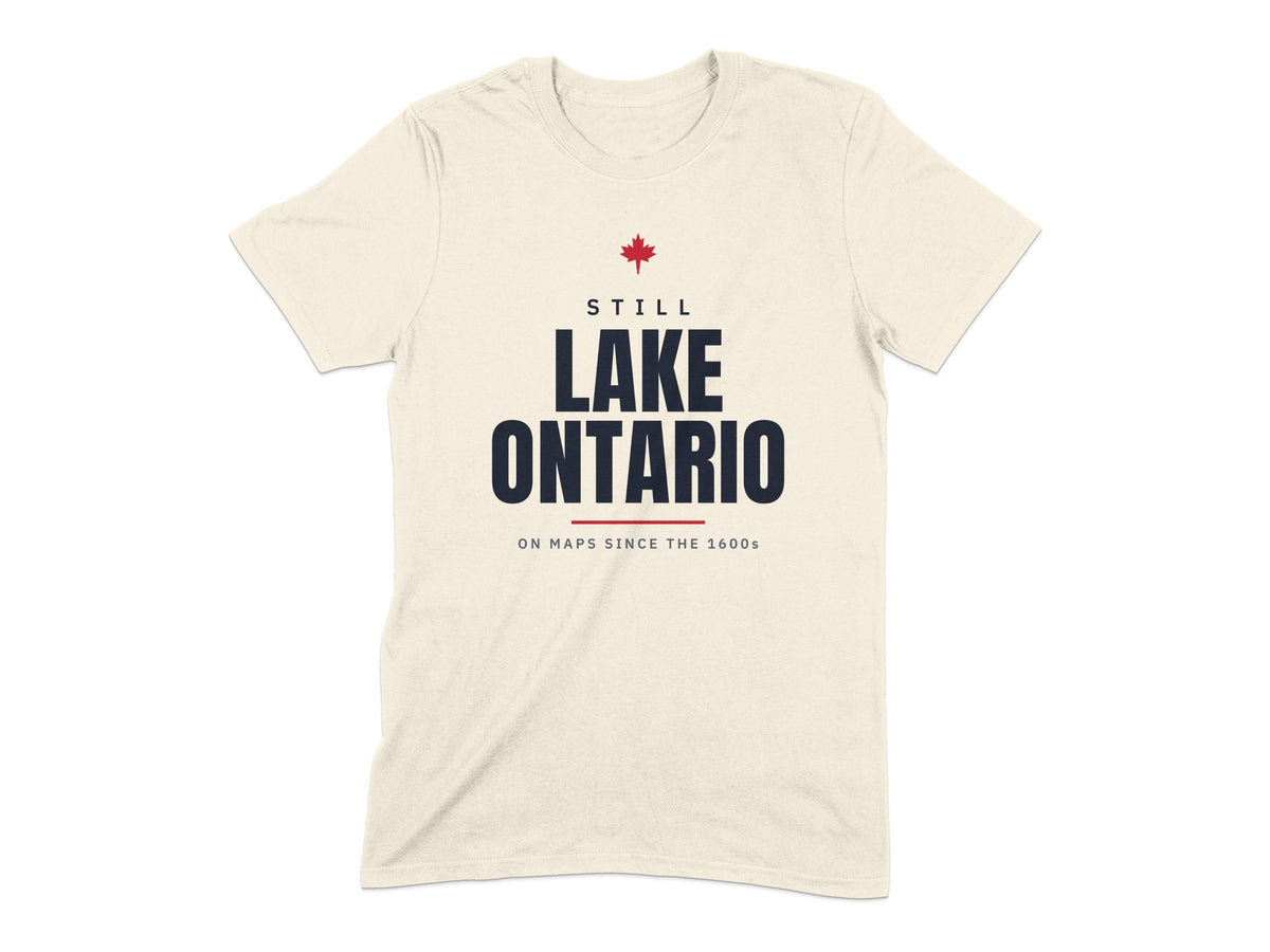 Cream t-shirt with "STILL LAKE ONTARIO ON MAPS SINCE THE 1600s" text and red maple leaf.