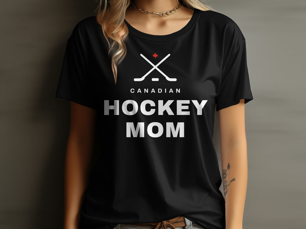 Black t-shirt with "Canadian Hockey Mom" text and crossed hockey sticks graphic.
