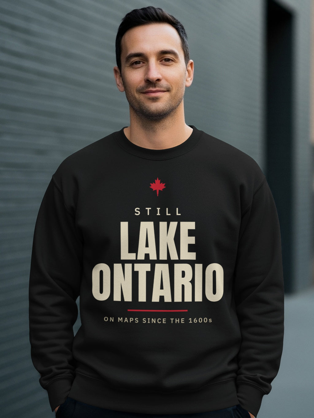 Black sweatshirt with "Still Lake Ontario On Maps Since The 1600s" text.