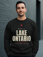 Black sweatshirt with "Still Lake Ontario On Maps Since The 1600s" text.