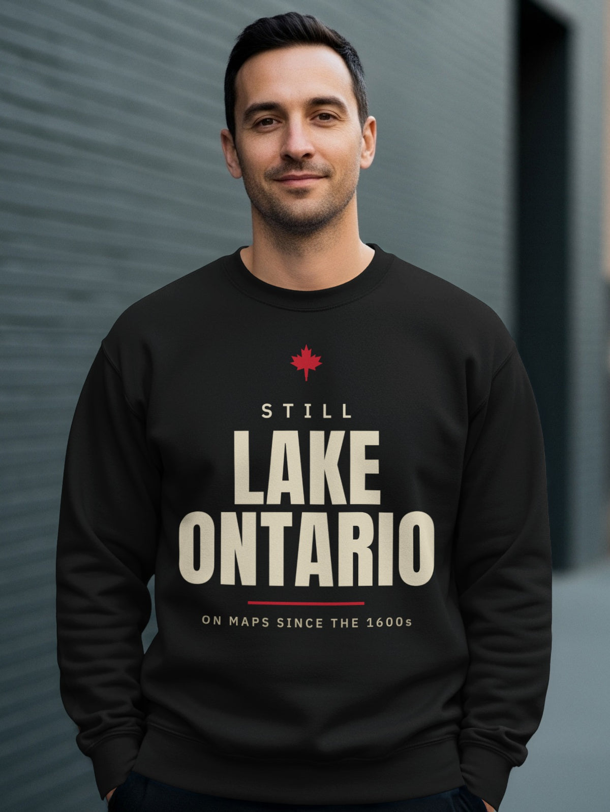 Black sweatshirt with "Still Lake Ontario On Maps Since The 1600s" text.