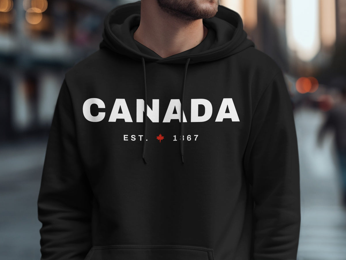Black hoodie with "CANADA EST. 1867" and a maple leaf.