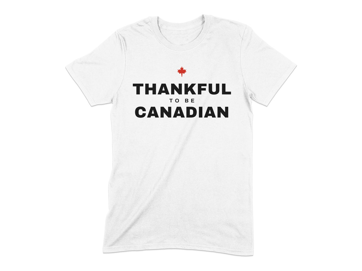White t-shirt with "THANKFUL TO BE CANADIAN" text and a red maple leaf.