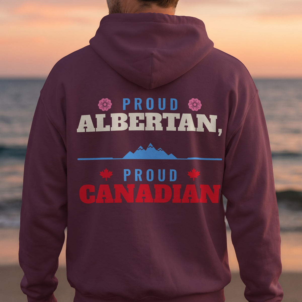 Maroon hoodie with text "Proud Albertan, Proud Canadian" and Canadian symbols.