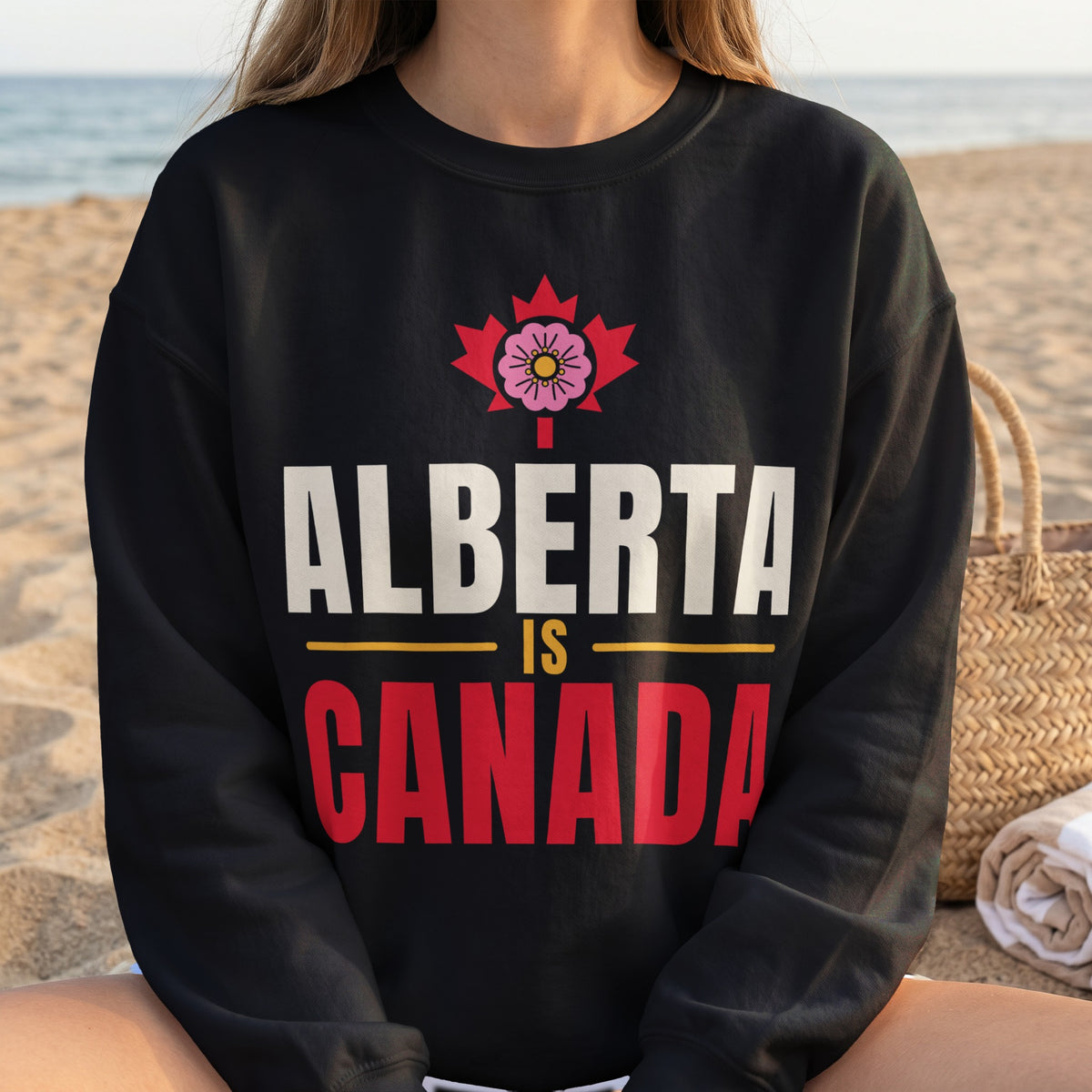 Black sweatshirt with "Alberta is Canada" text and Alberta's provincial flower.