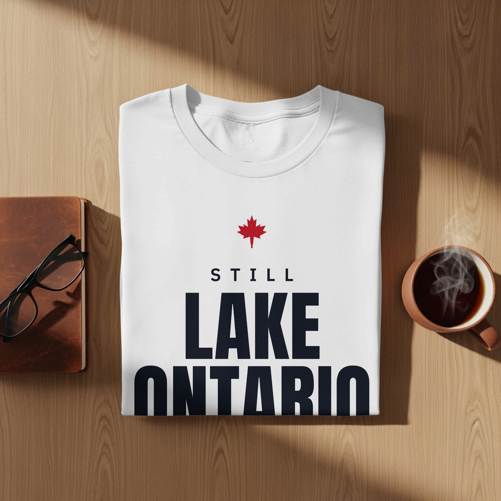 White t-shirt with red maple leaf and text "STILL LAKE ONTARIO"