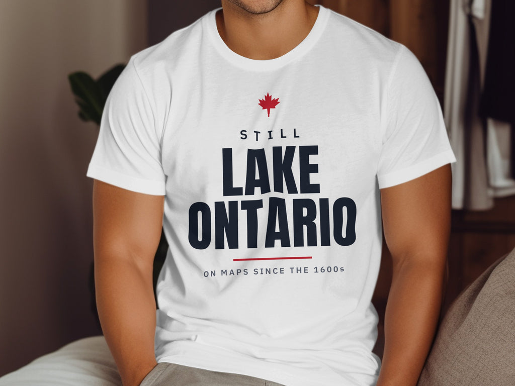 White t-shirt with "Still Lake Ontario On Maps Since The 1600s" text.