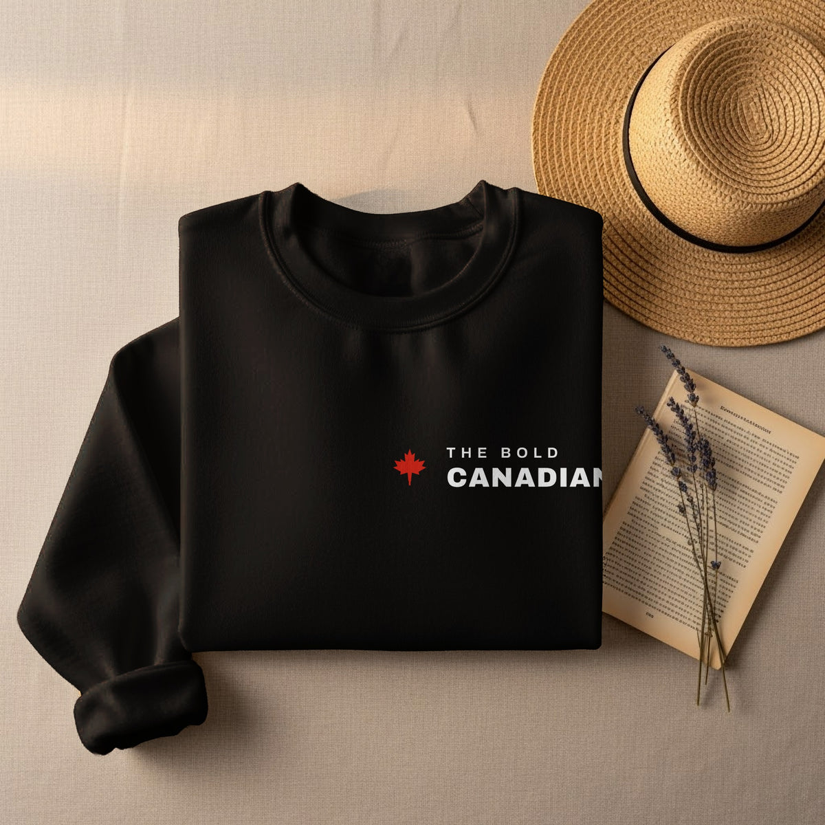 Black sweatshirt with a red maple leaf and "THE BOLD CANADIAN" text.
