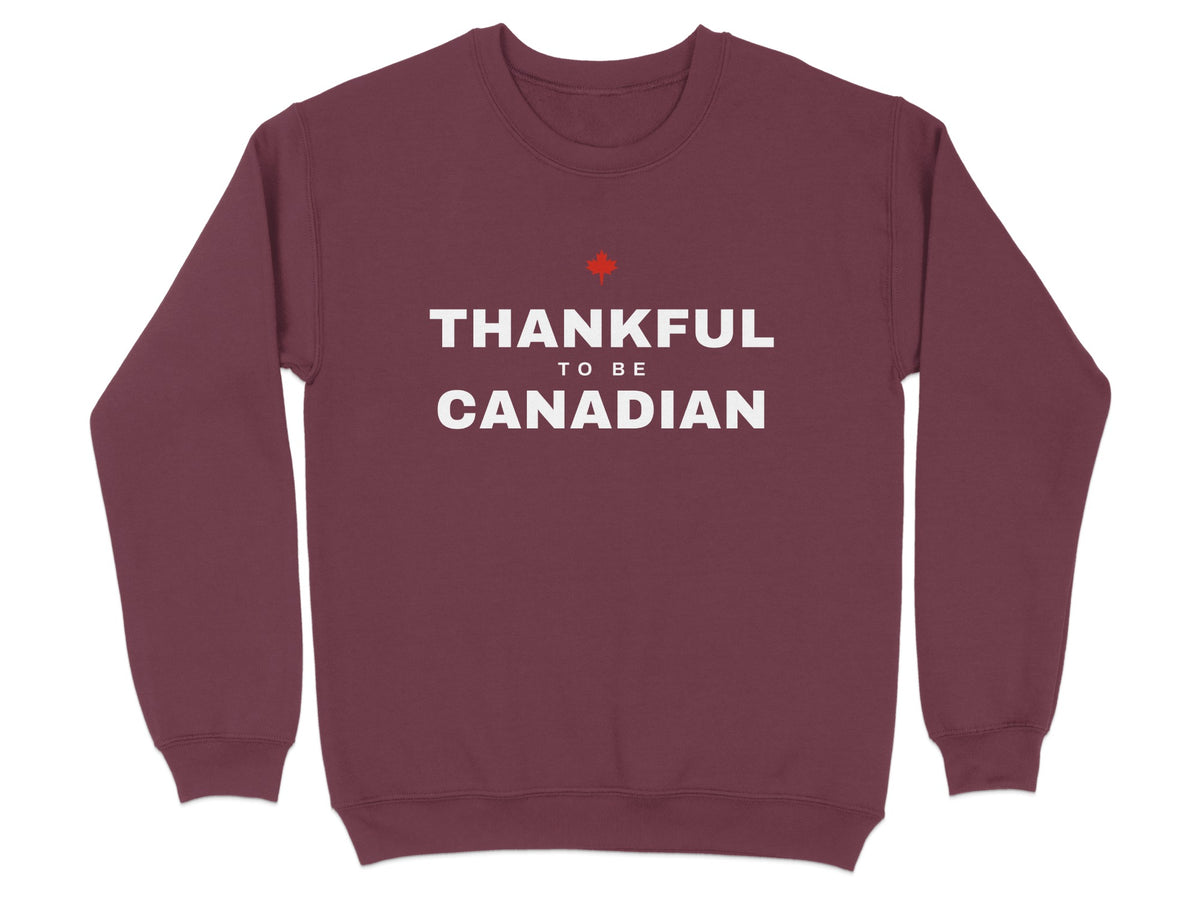 Maroon sweatshirt with white text reading "THANKFUL TO BE CANADIAN" and a red maple leaf.