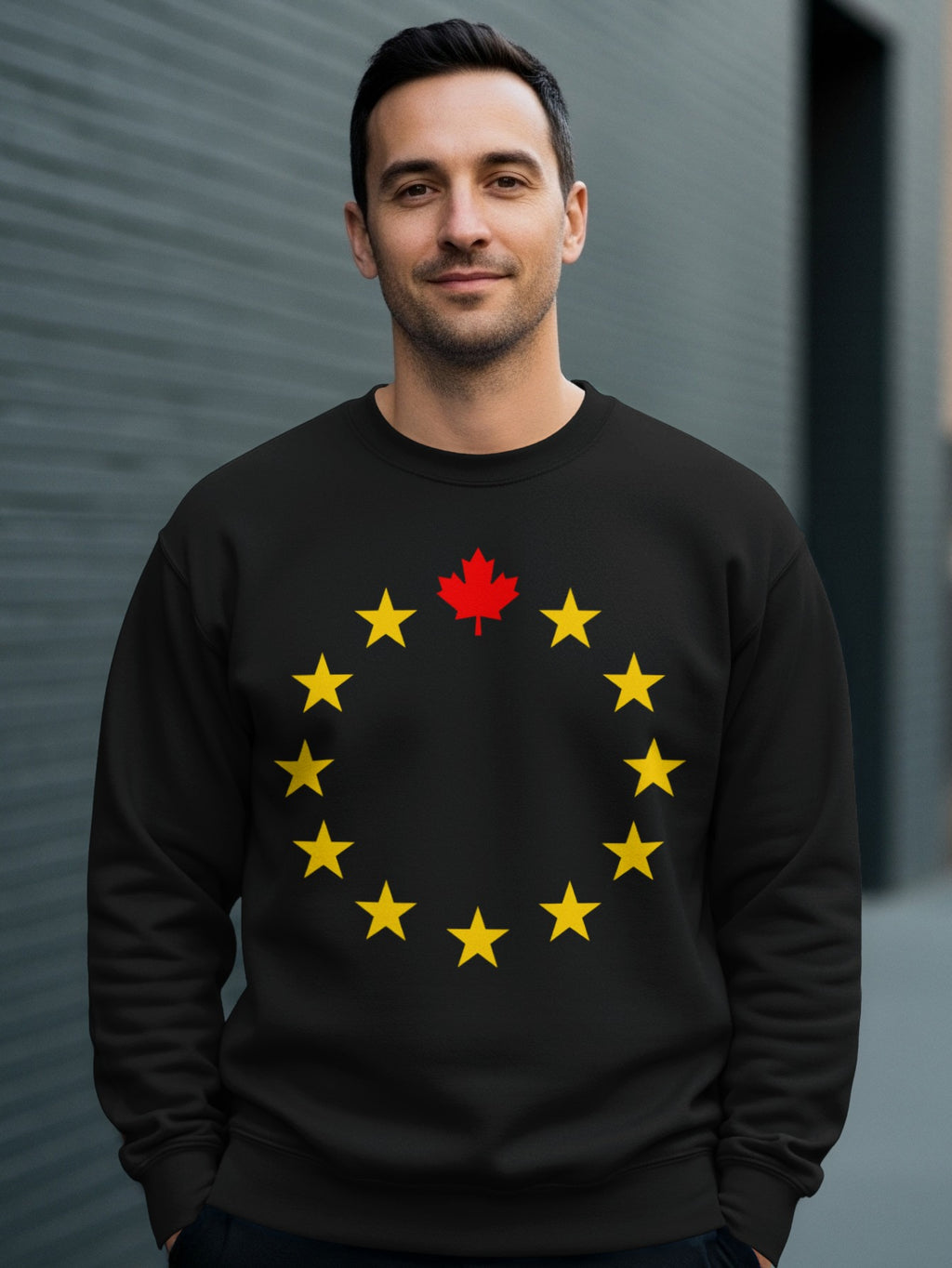Black sweatshirt with a circle of yellow stars and a red maple leaf.