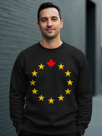 Black sweatshirt with a circle of yellow stars and a red maple leaf.