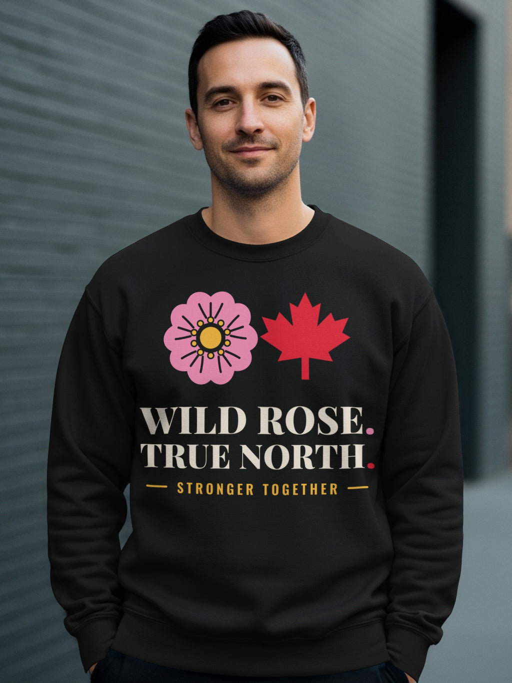 Black sweatshirt with pink rose, red maple leaf, and "WILD ROSE. TRUE NORTH. STRONGER TOGETHER." text.