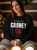 Black sweatshirt with white text "CARNEY ON." and smaller white text above.