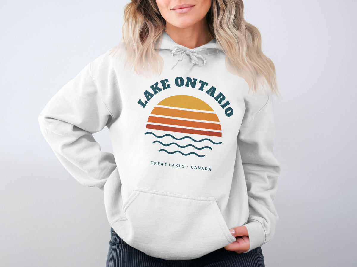 White hoodie with "Lake Ontario Great Lakes Canada" graphic and sunset design.