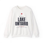 White sweatshirt with "Still Lake Ontario On Maps Since The 1600s" text.