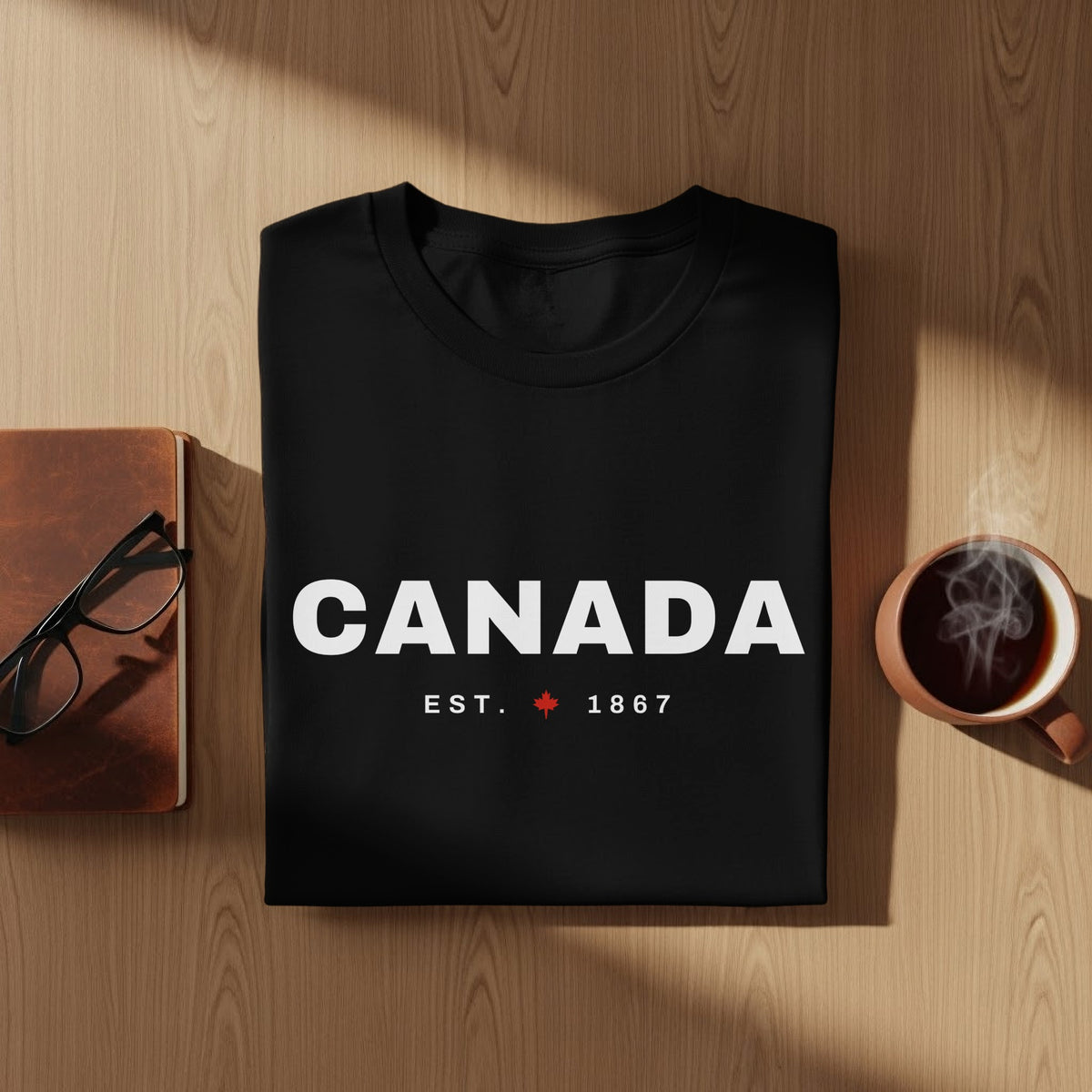 Black t-shirt with white "CANADA EST. 1867" text and maple leaf.