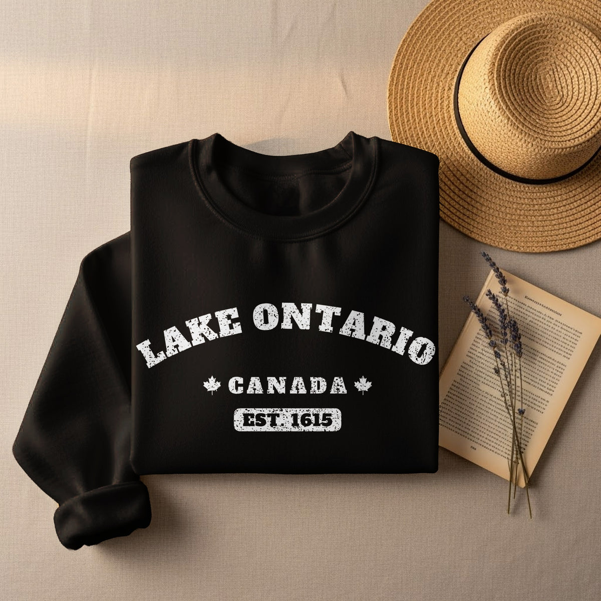 Black sweatshirt with "Lake Ontario Canada Est. 1615" text.