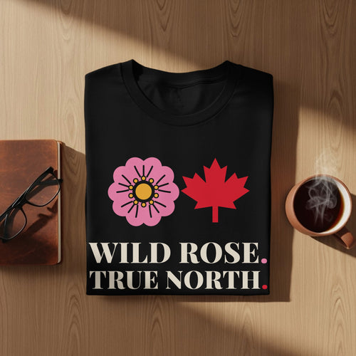 Black t-shirt with pink wild rose, red maple leaf, and text "WILD ROSE. TRUE NORTH."
