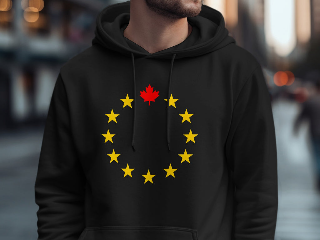 Black hoodie with a ring of yellow stars and a red maple leaf.