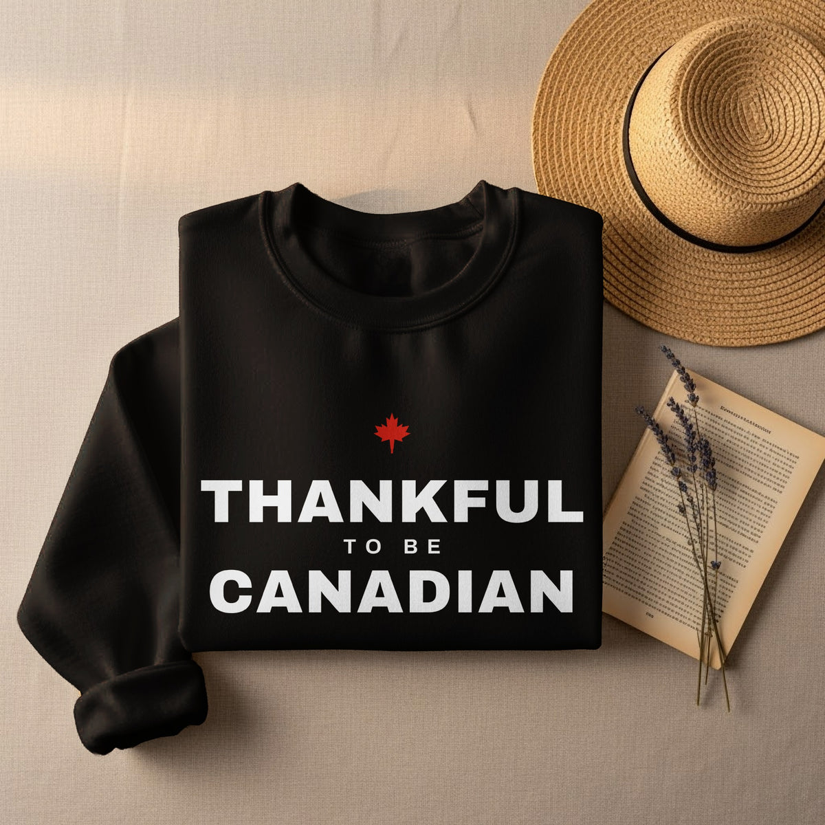 Black sweatshirt with white text "THANKFUL TO BE CANADIAN" and a red maple leaf.