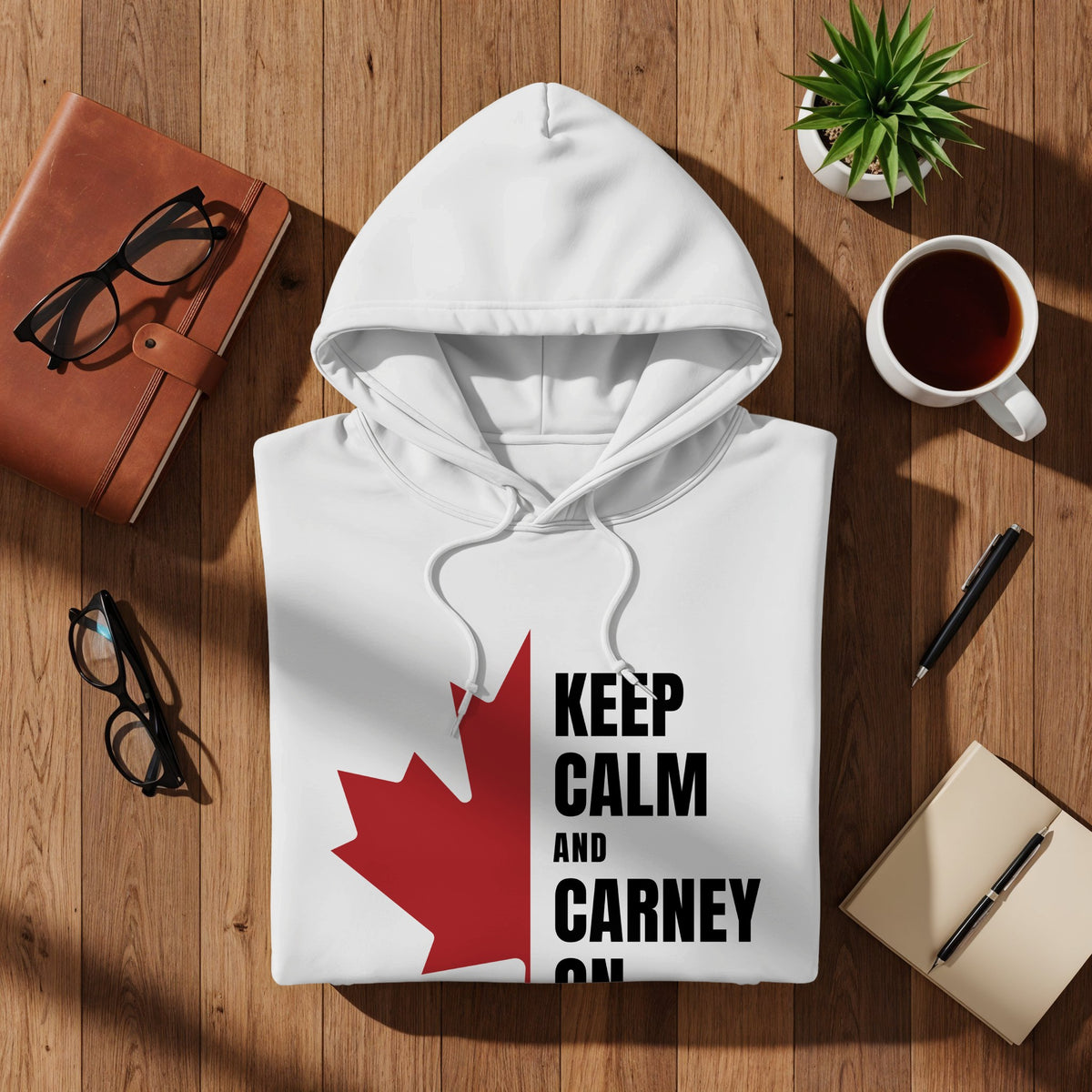 White hoodie with "Keep Calm and Carney On" text and a Canadian maple leaf.