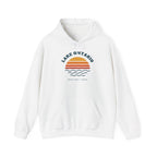White hoodie with a graphic of a sunset over waves and text "Lake Ontario Great Lakes Canada".