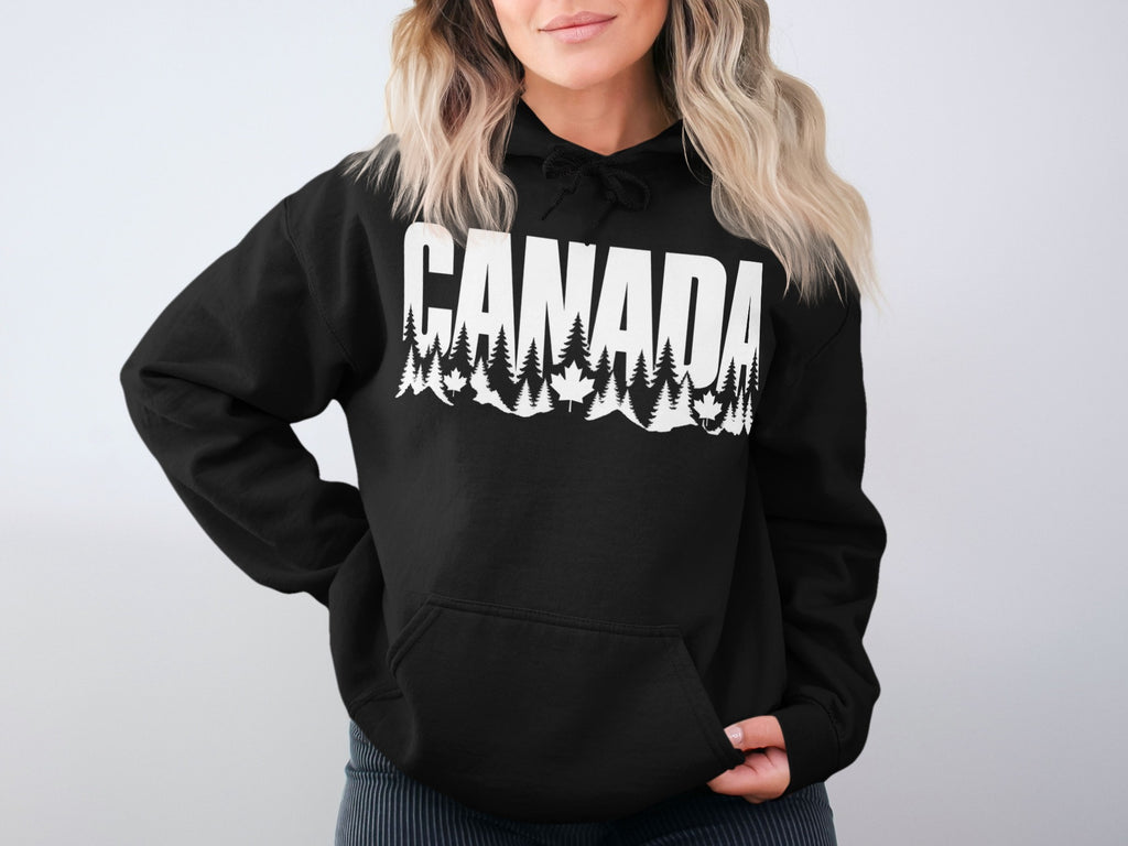 Black hoodie with "CANADA" text featuring trees and maple leaves design