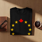 Black t-shirt with red maple leaf and yellow stars design.